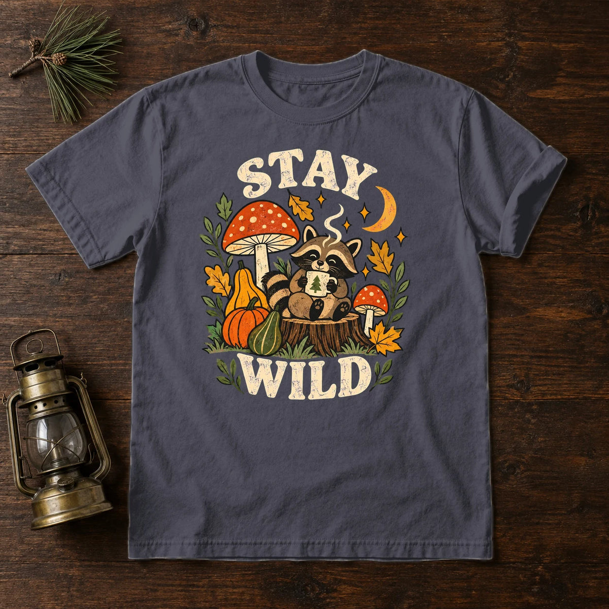 Cozy Autumn Raccoon Stay Wild Graphic Tee on Navy Premium Tee