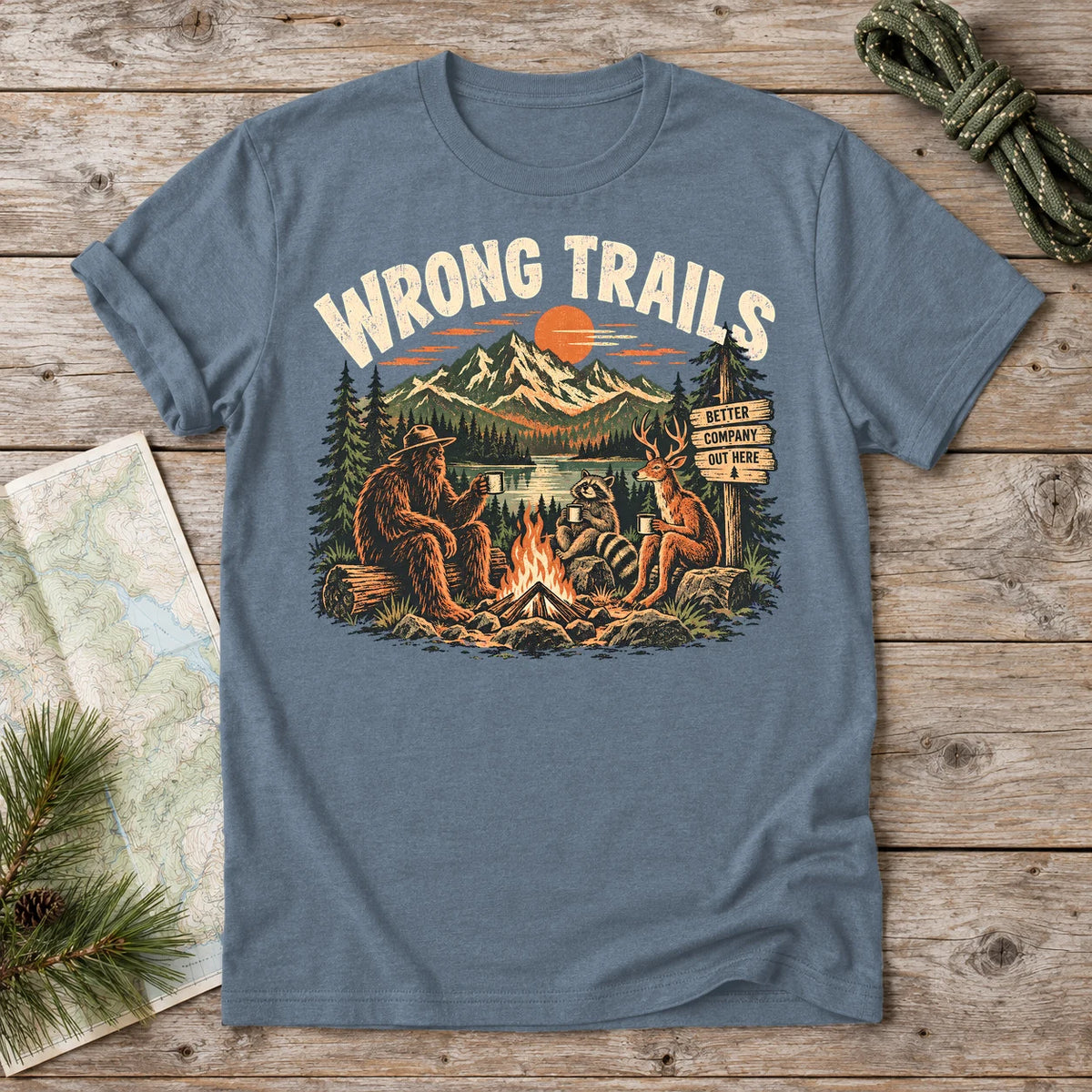 Wrong Trails Bigfoot Campfire Graphic Tee on Heather Indigo Everyday Soft Tee