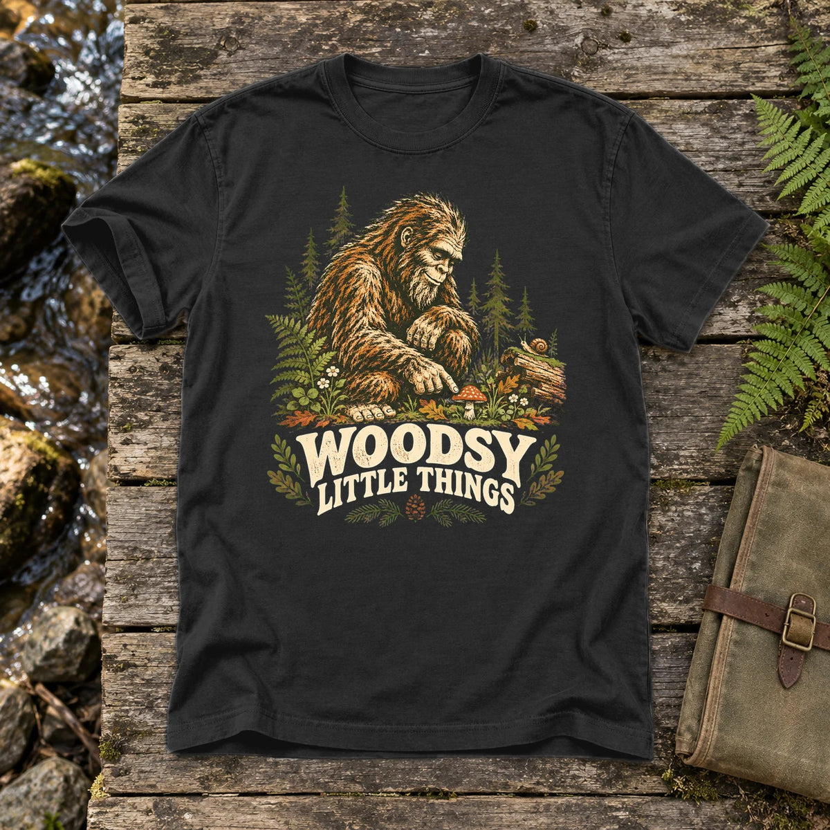 Woodsy Little Things Bigfoot Graphic Tee on Black Premium Tee