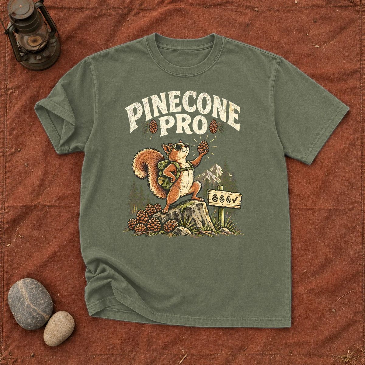 Pinecone Pro Vintage Hiker Squirrel Graphic Tee on Moss Premium Tee