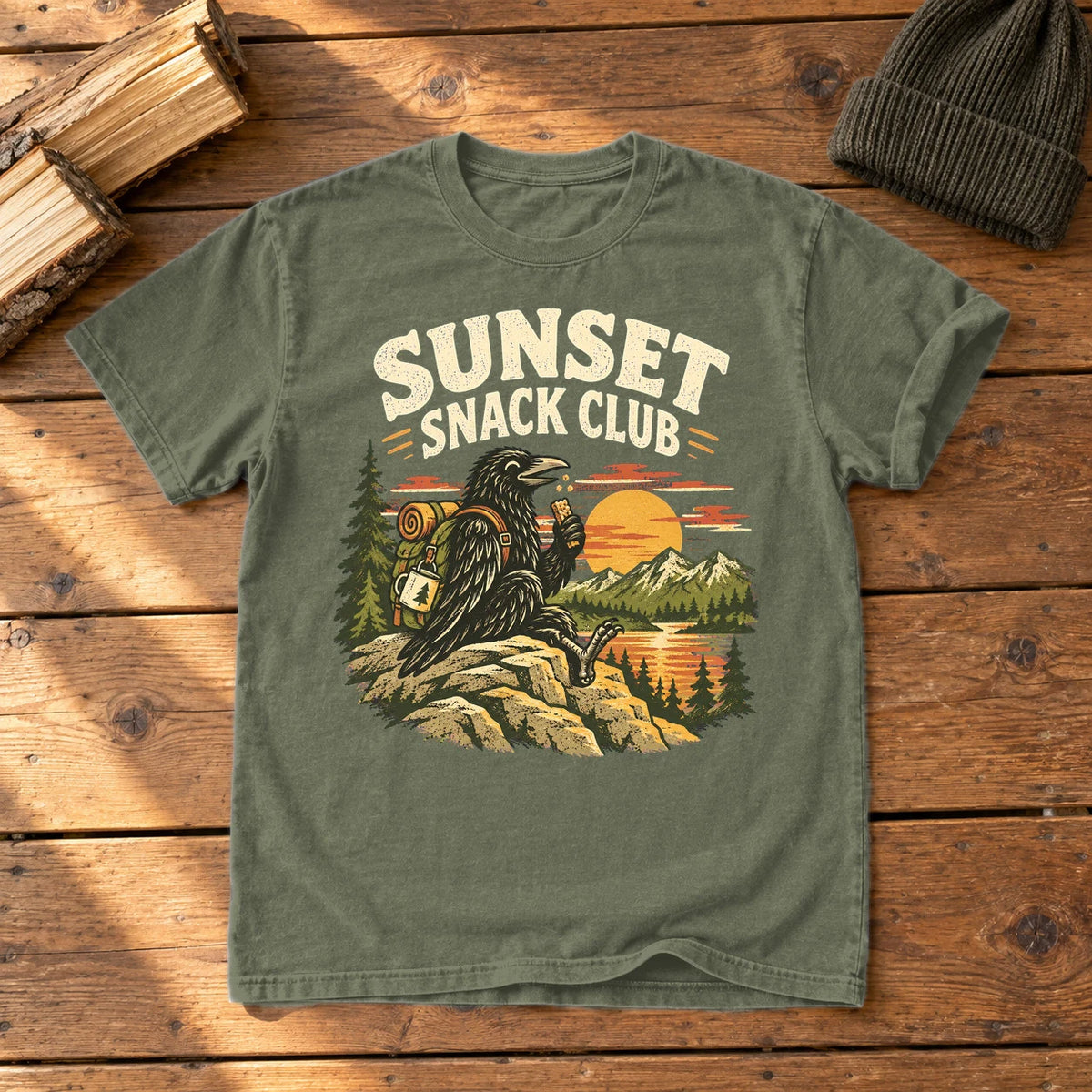 Sunset Snack Club Raven Graphic Tee on Moss Premium Tee