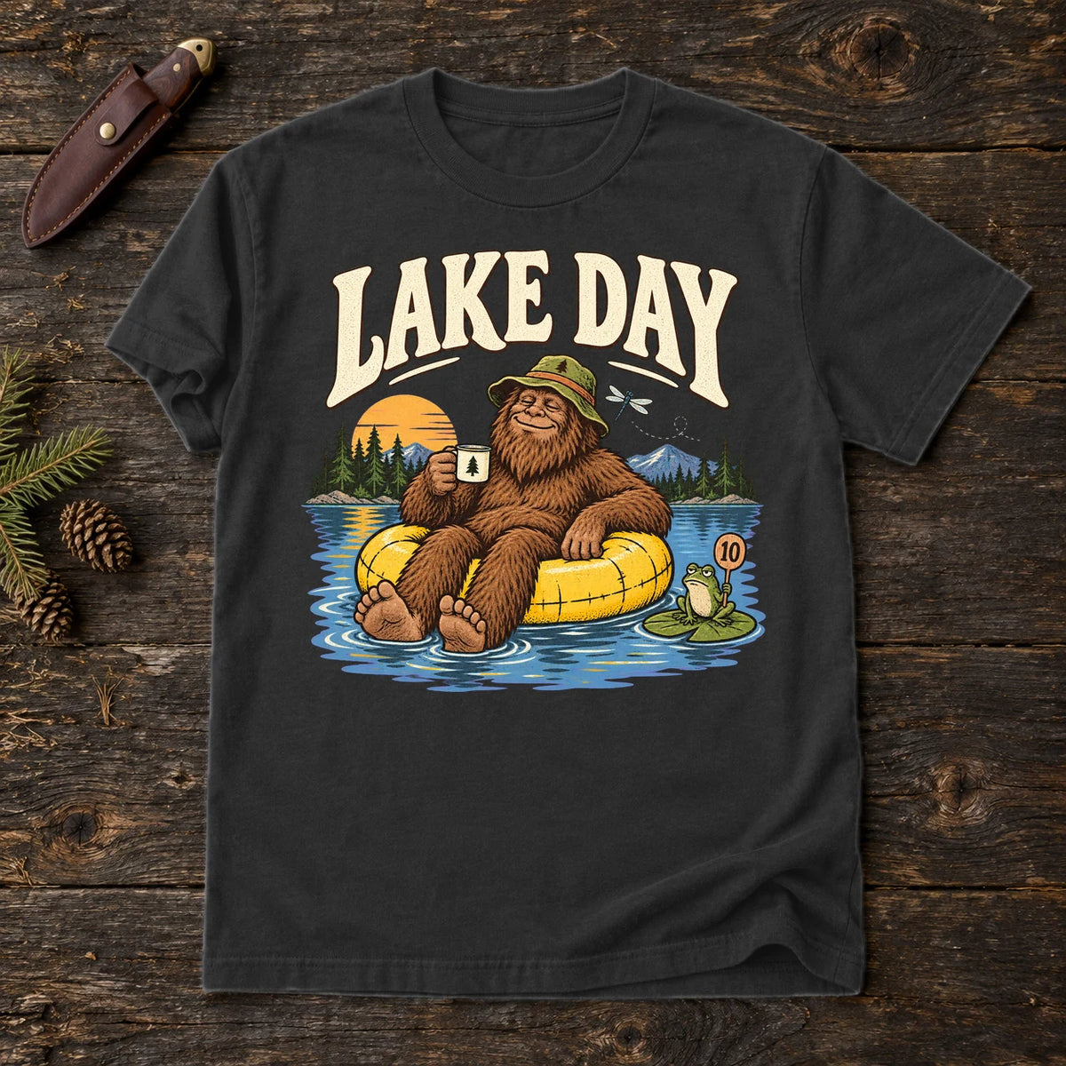 Lake Day Bigfoot Graphic Tee on Black Premium Tee