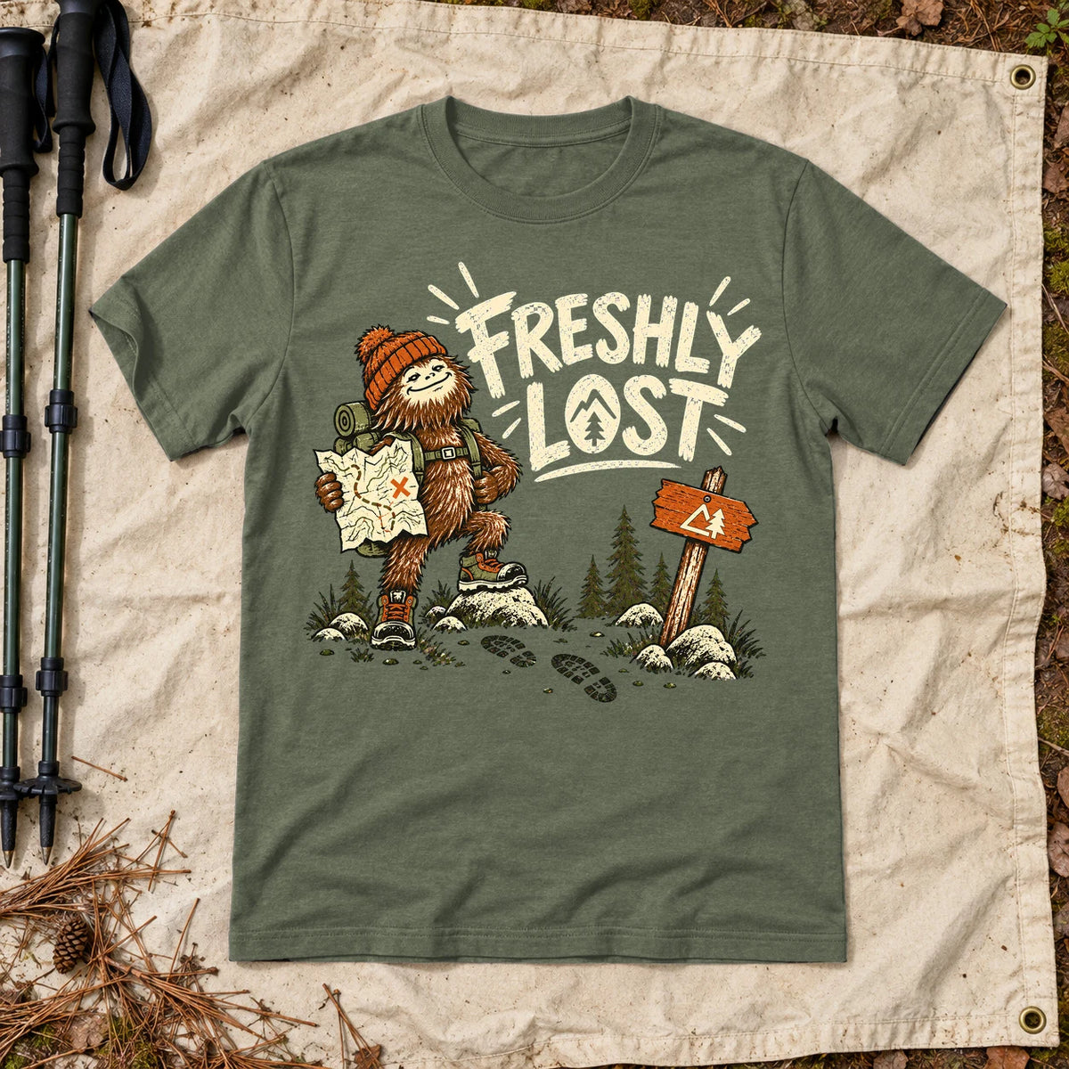 Freshly Lost Sasquatch Hiker Graphic Tee on Military Green Everyday Soft Tee