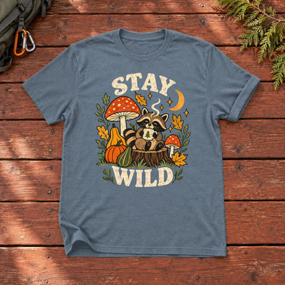 Cozy Autumn Raccoon Stay Wild Graphic Tee on Heather Indigo Everyday Soft Tee