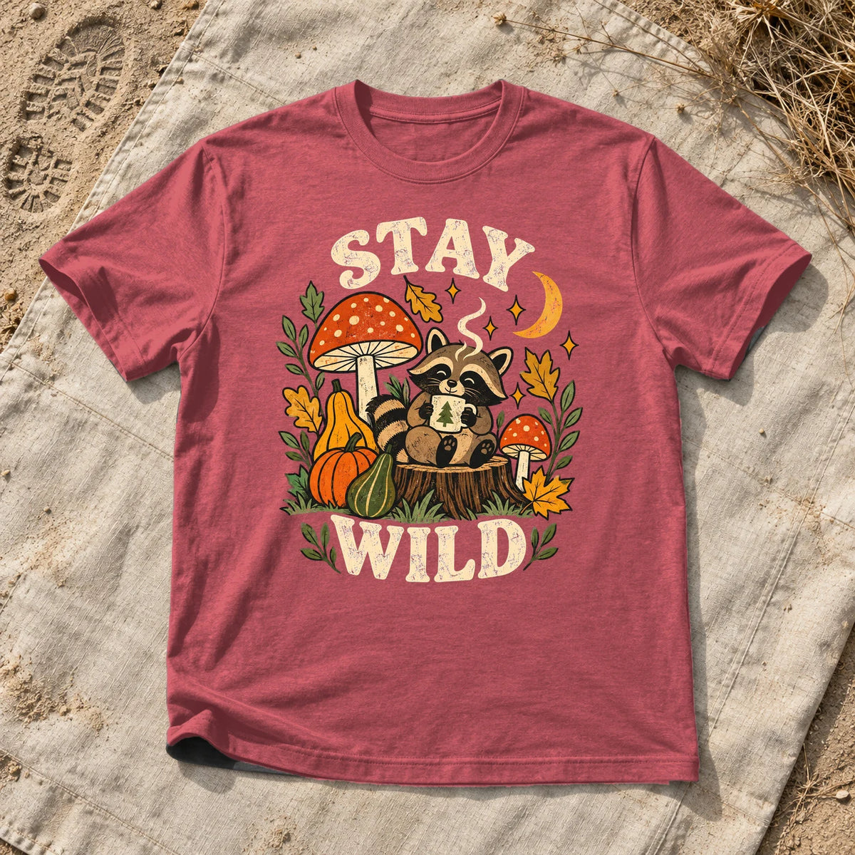 Cozy Autumn Raccoon Stay Wild Graphic Tee on Heather Red Everyday Soft Tee