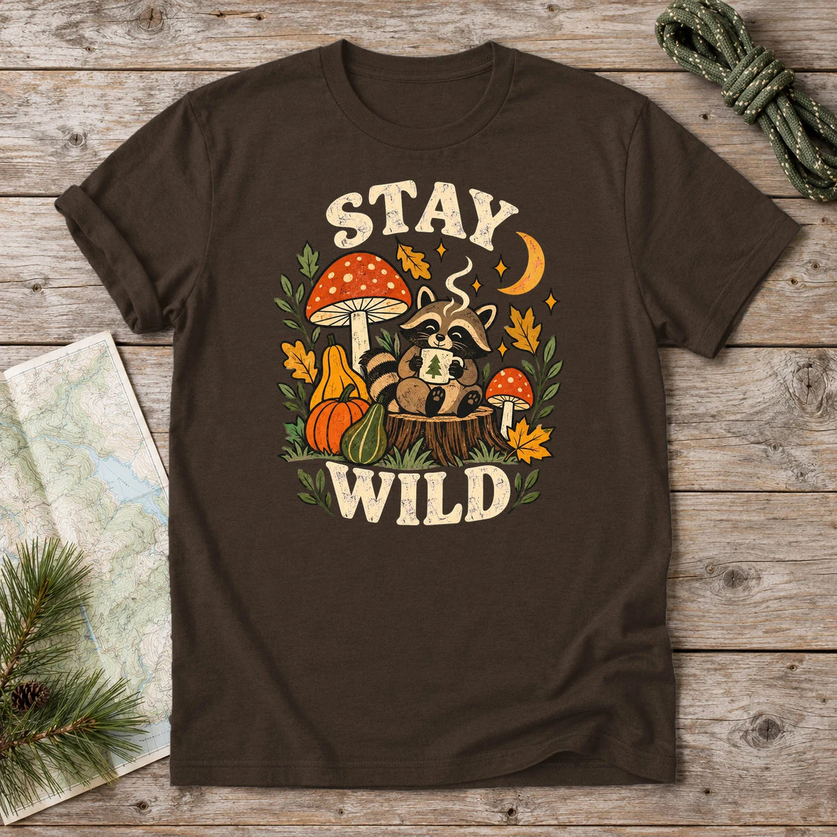 Cozy Autumn Raccoon Stay Wild Graphic Tee on Dark Chocolate Everyday Soft Tee