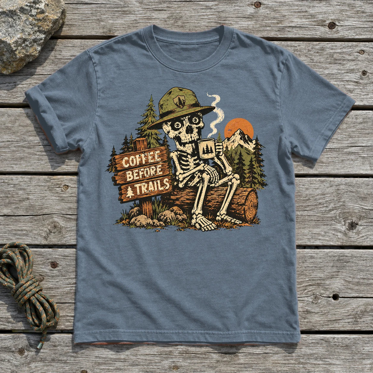 Coffee Before Trails Skeleton Graphic Tee on Heather Indigo Everyday Soft Tee
