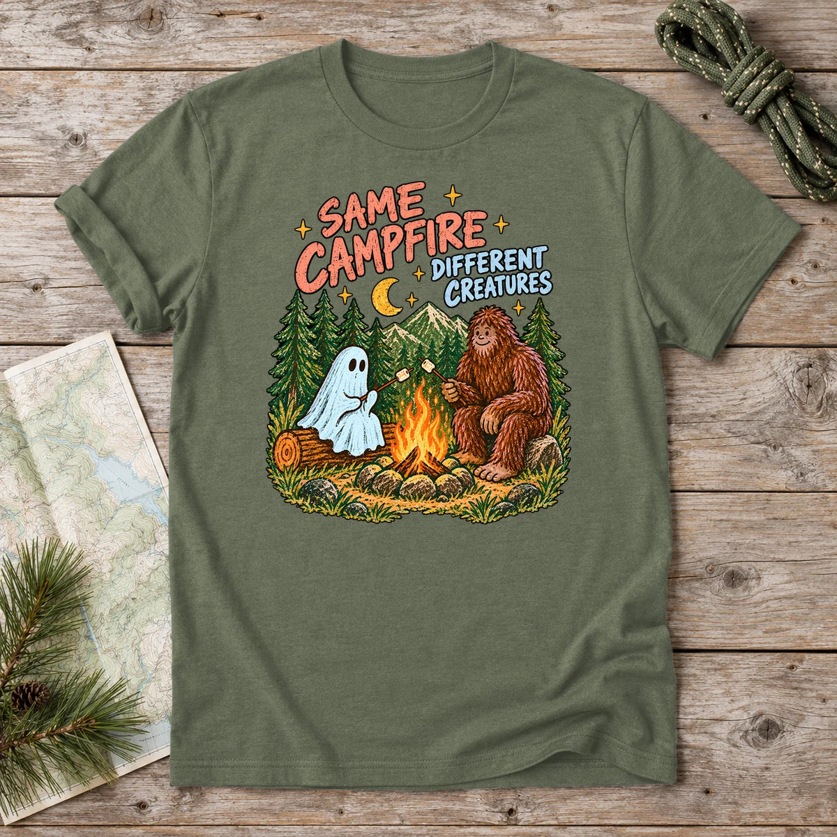 Same Campfire Different Creatures Graphic Tee on Military Green Everyday Soft Tee