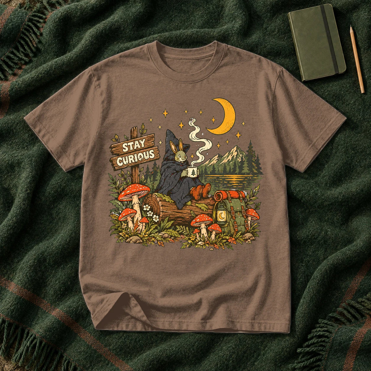 Stay Curious Woodland Wanderer Graphic Tee on Espresso Premium Tee