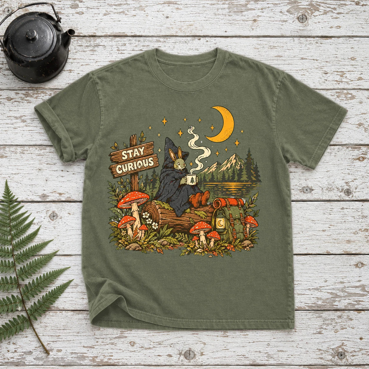 Stay Curious Woodland Wanderer Graphic Tee on Moss Premium Tee