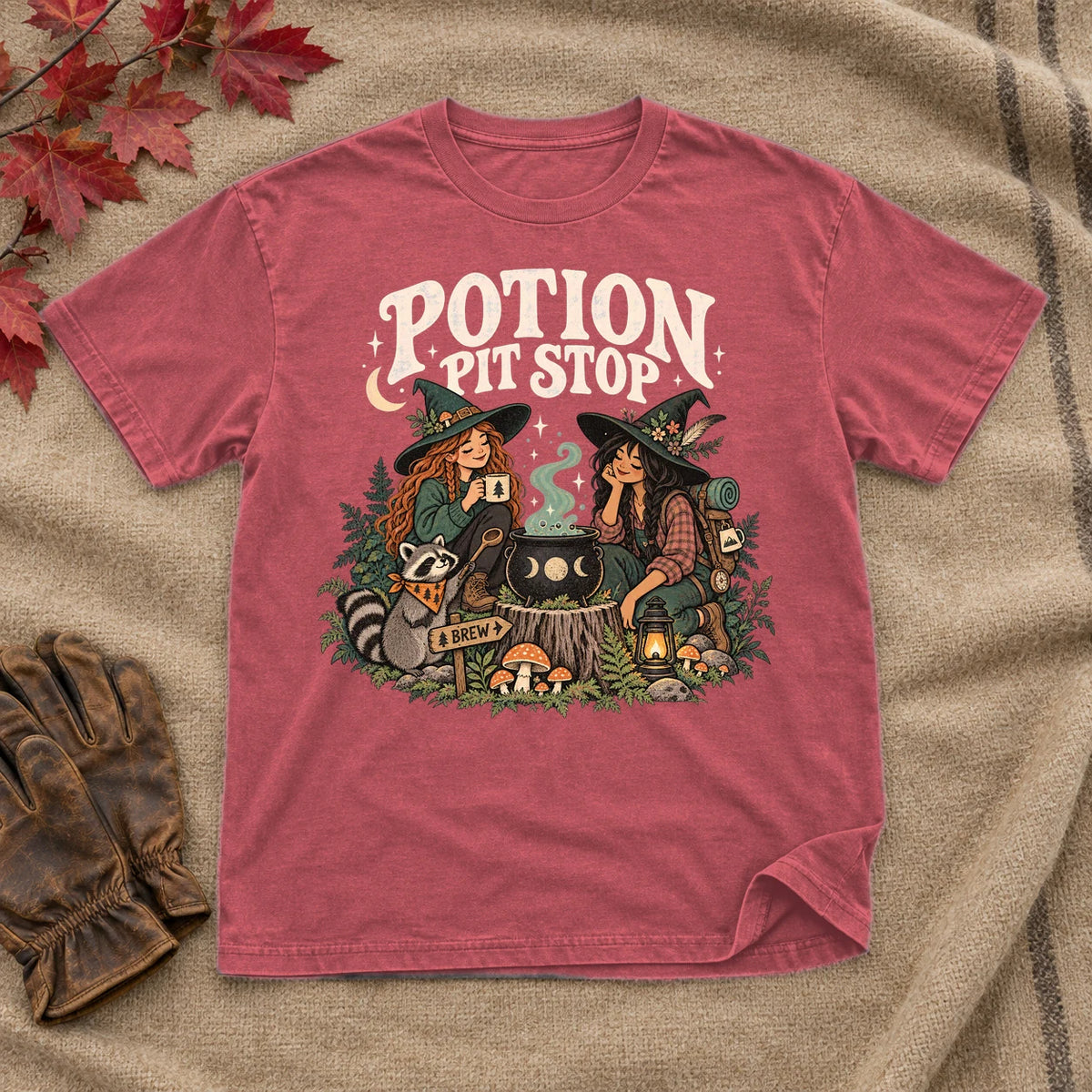 Potion Pit Stop Cozy Witch Graphic Tee on Heather Red Everyday Soft Tee