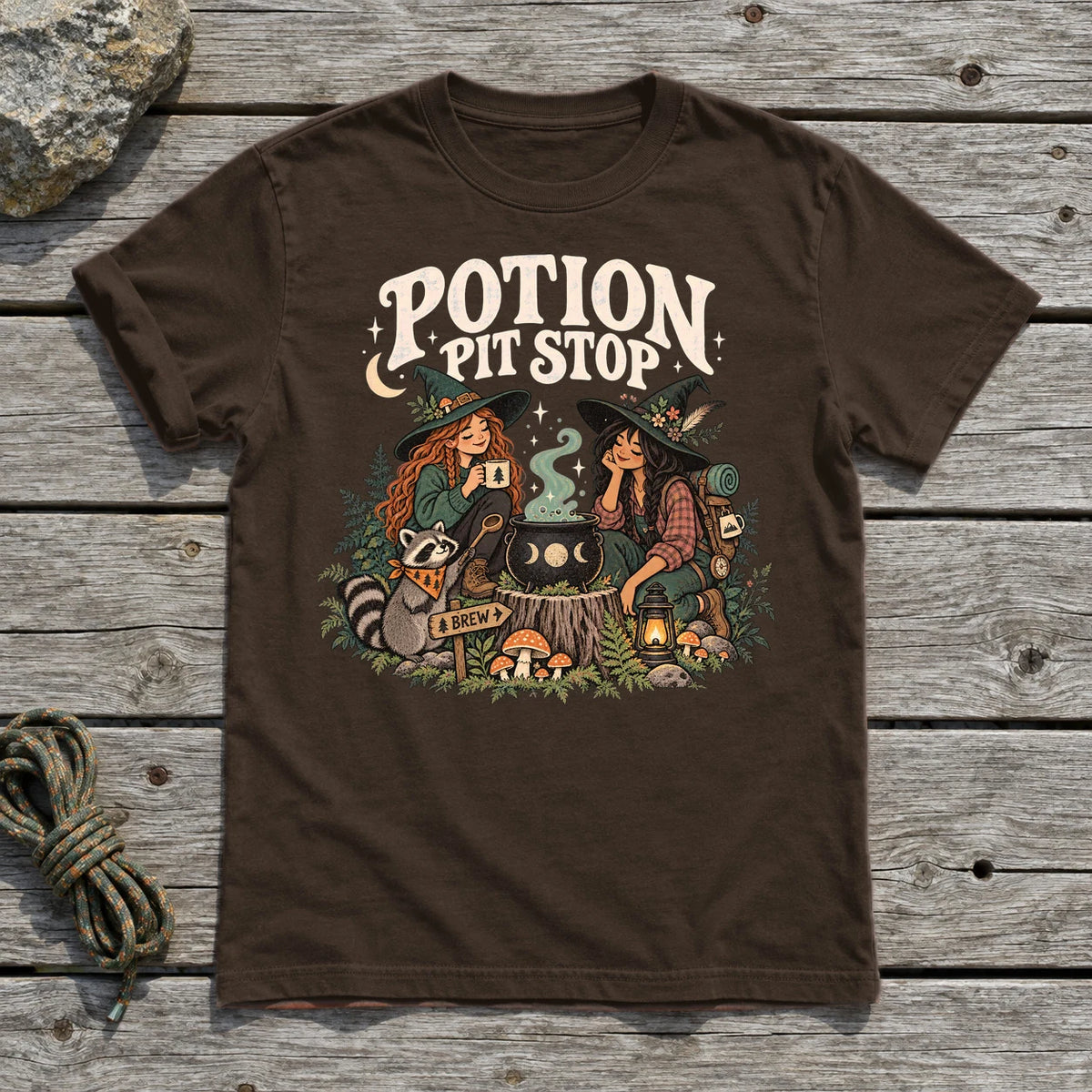 Potion Pit Stop Cozy Witch Graphic Tee on Dark Chocolate Everyday Soft Tee
