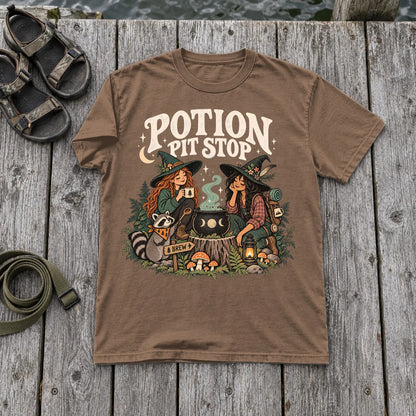Potion Pit Stop Cozy Witch Graphic Tee on Espresso Premium Tee