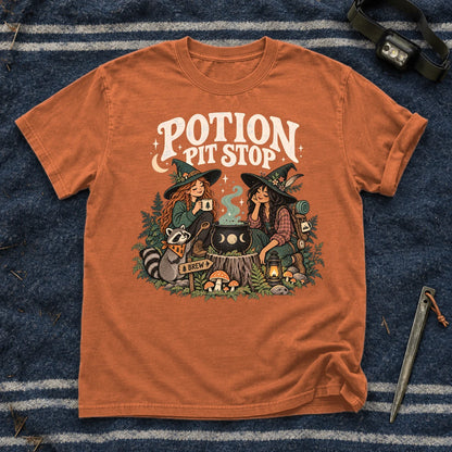 Potion Pit Stop Cozy Witch Graphic Tee on Yam Premium Tee