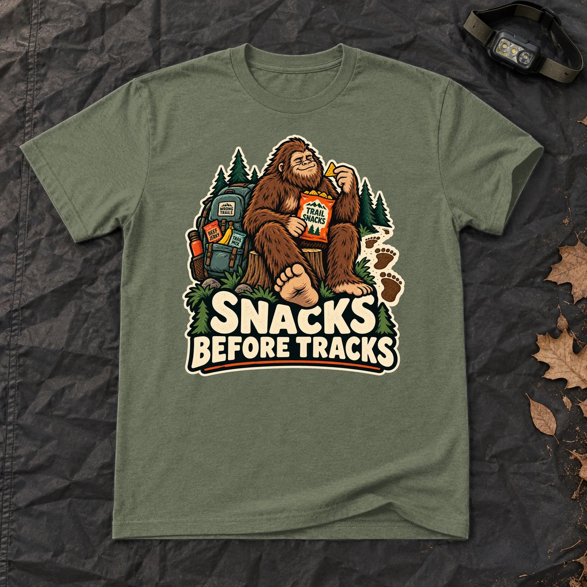 Snacks Before Tracks Bigfoot Graphic Tee on Military Green Everyday Soft Tee