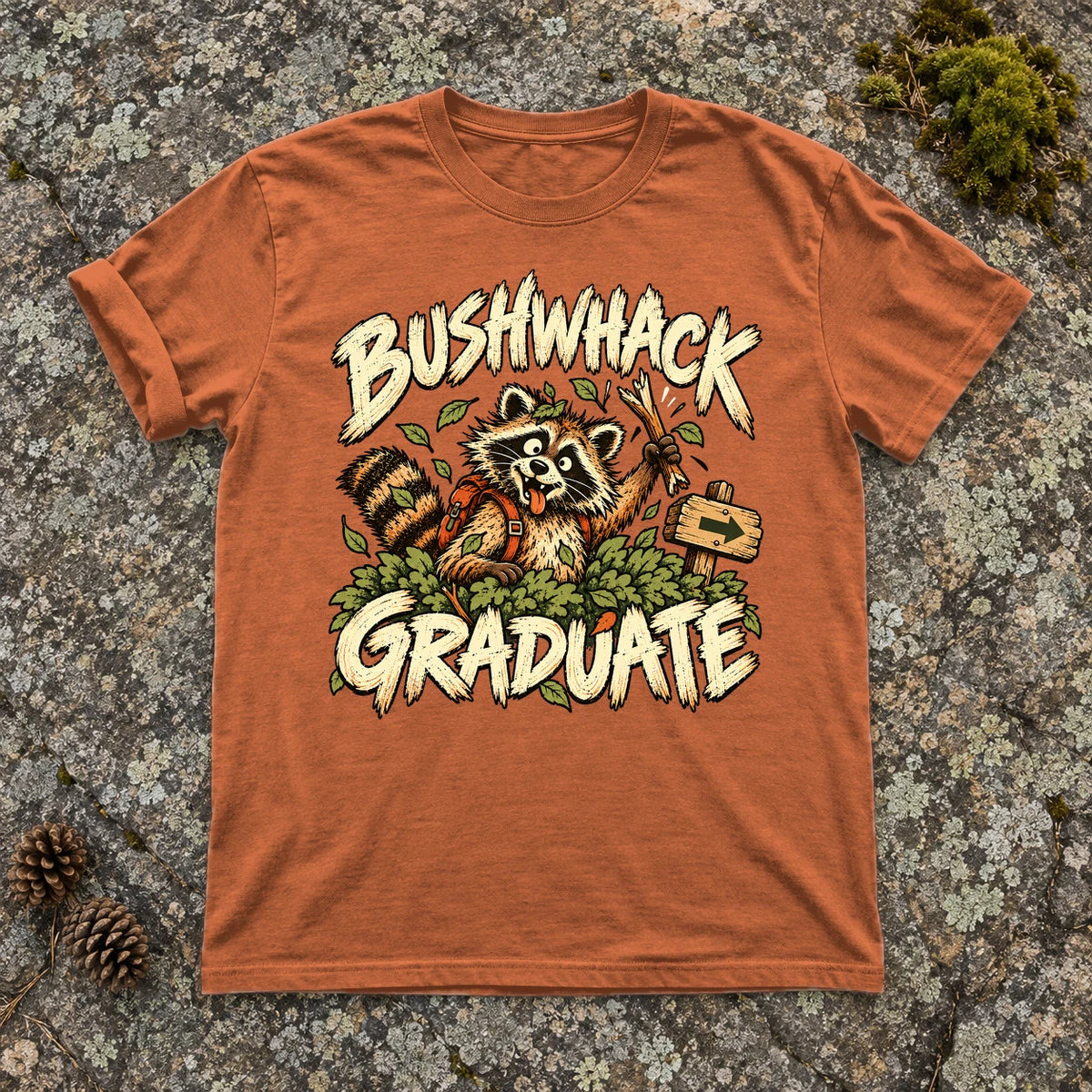 Bushwhack Graduate Raccoon Graphic Tee on Yam Premium Tee