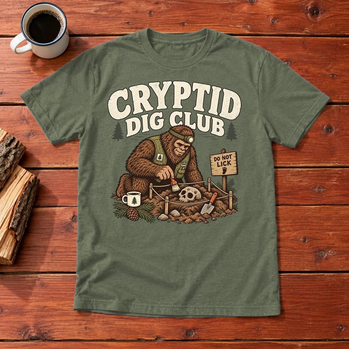 Cryptid Dig Club Graphic Tee on Military Green Everyday Soft Tee