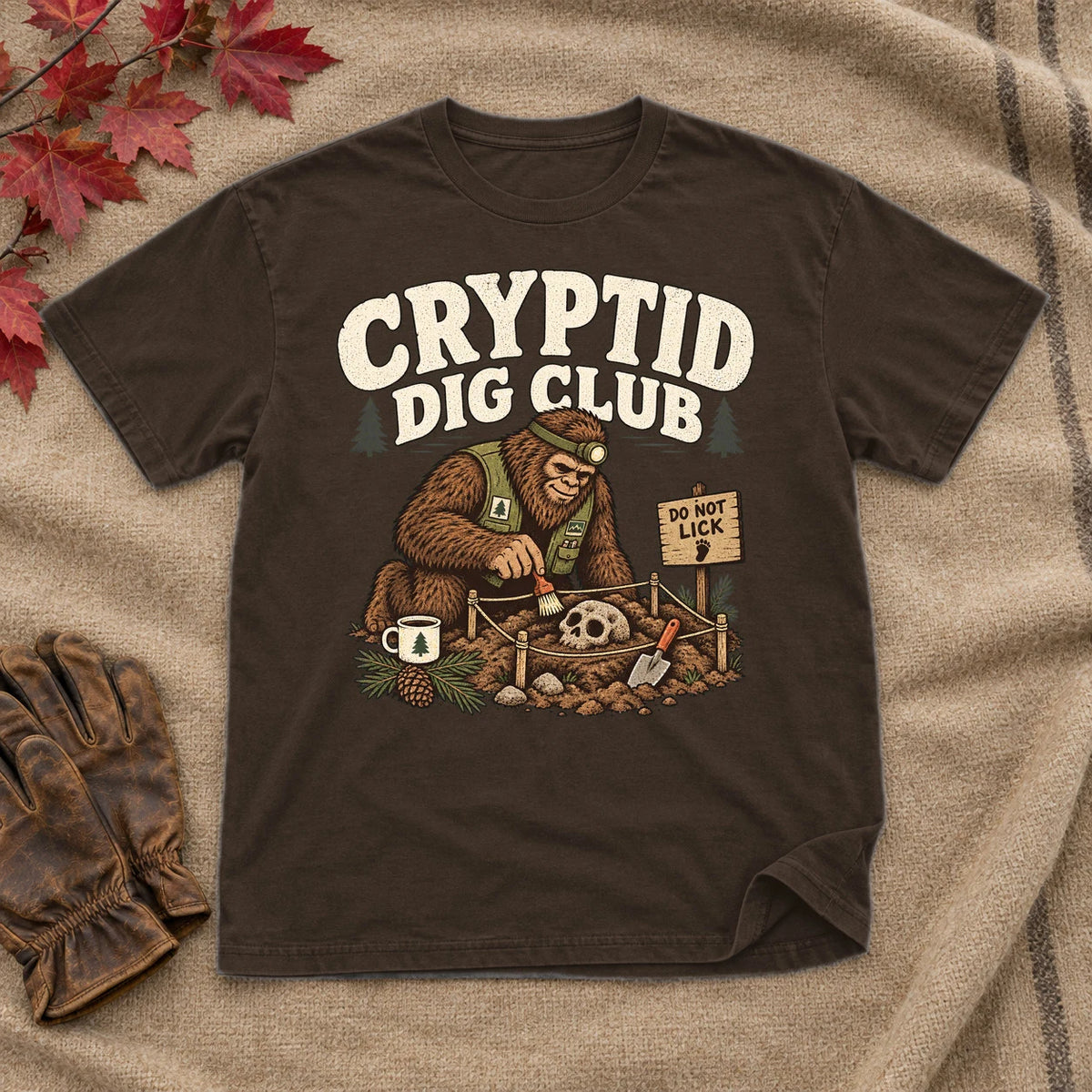 Cryptid Dig Club Graphic Tee on Dark Chocolate Everyday Soft Tee