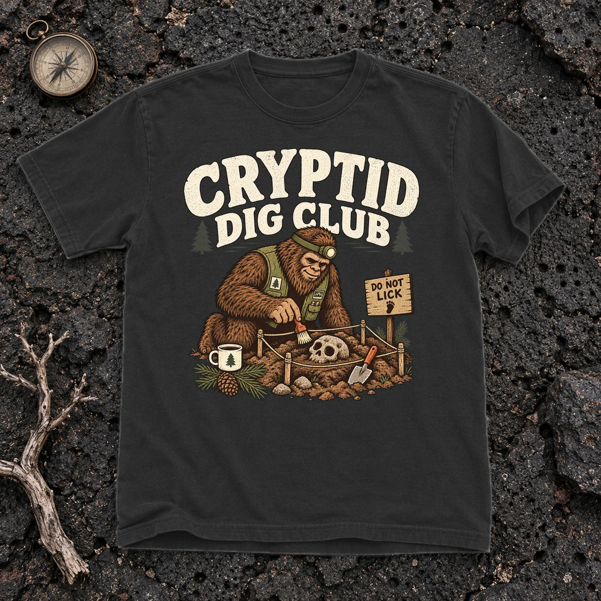 Cryptid Dig Club Graphic Tee on Black Premium Tee