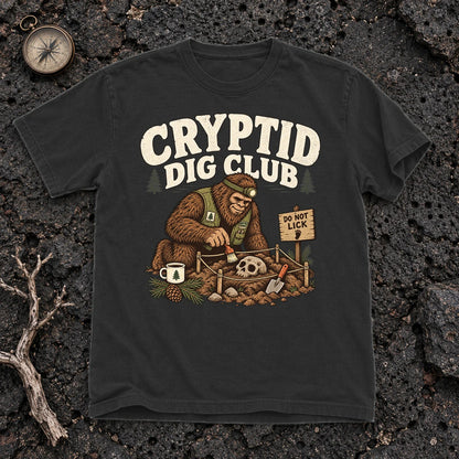 Cryptid Dig Club Graphic Tee on Black Premium Tee