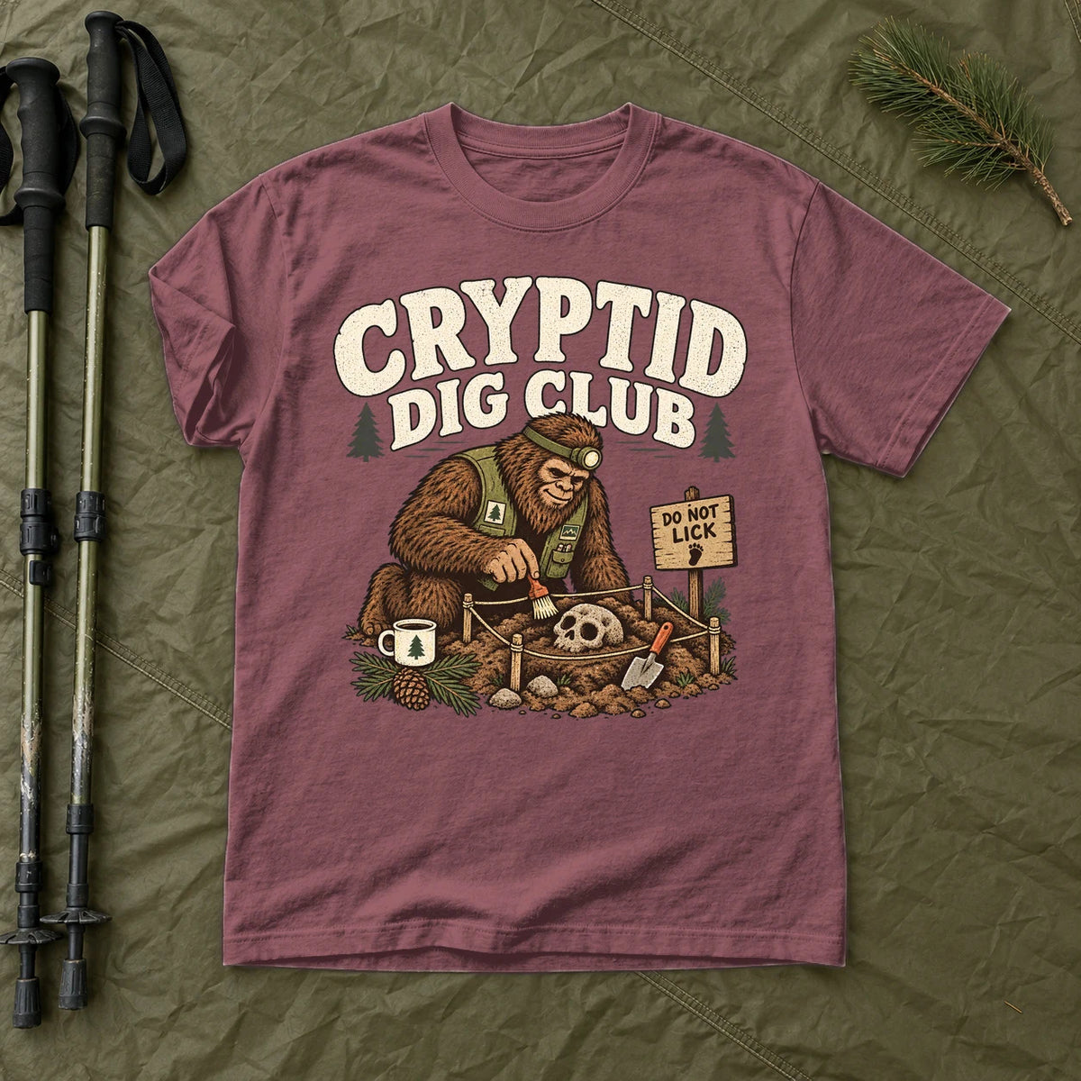 Cryptid Dig Club Graphic Tee on Brick Premium Tee