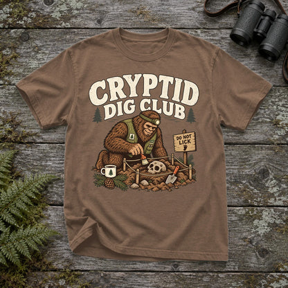 Cryptid Dig Club Graphic Tee on Espresso Premium Tee