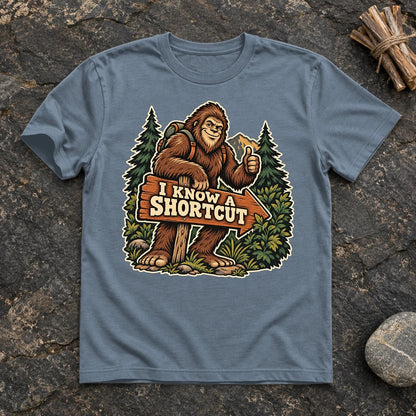 Bigfoot 'I Know A Shortcut' Graphic Tee on Heather Indigo Everyday Soft Tee