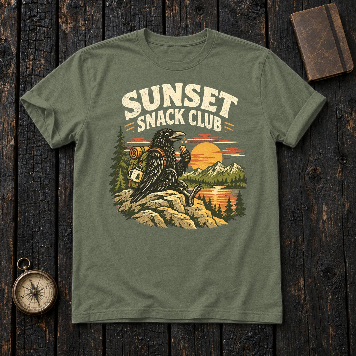 Sunset Snack Club Raven Graphic Tee on Military Green Everyday Soft Tee