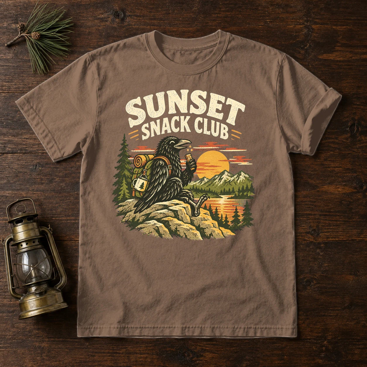 Sunset Snack Club Raven Graphic Tee on Espresso Premium Tee