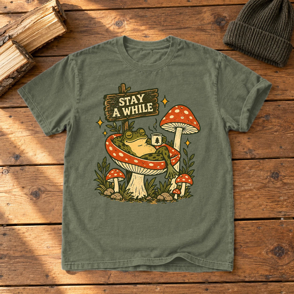 Stay A While Mushroom Frog Graphic Tee on Moss Premium Tee