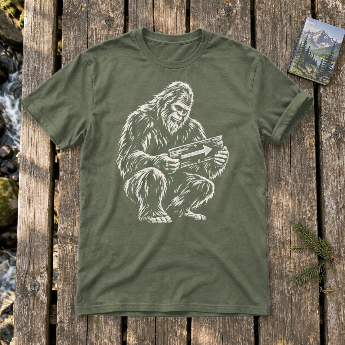 Sasquatch Trail Guide Graphic Tee on Military Green Everyday Soft Tee