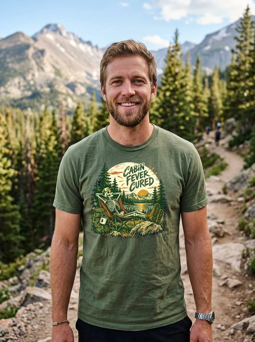Model wearing the Everyday Soft Tee (Gildan 64000 in Military Green) on trail featuring Cabin Fever Cured graphic